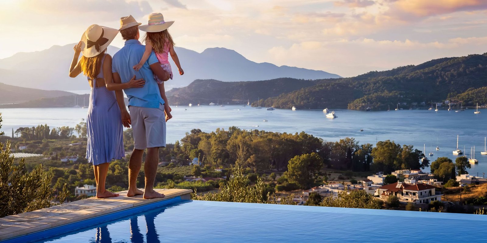A family looking out over the sea from a terrace in Greece